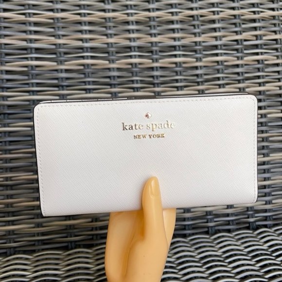 kate spade Handbags - Kate Spade Staci Large Slim Bifold Wallet Parchment